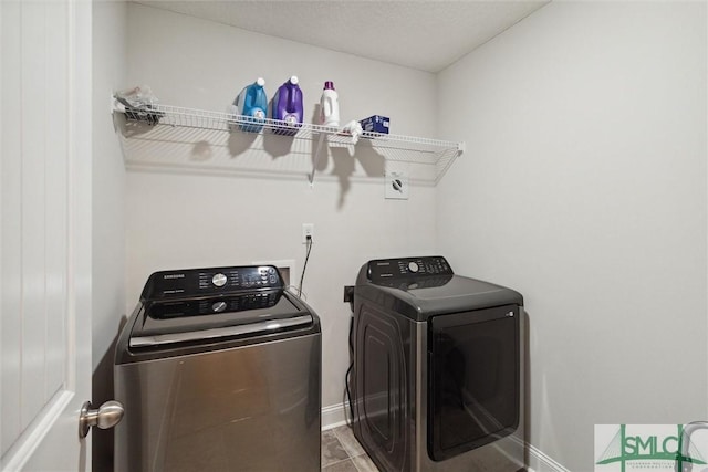 laundry area with independent washer and dryer