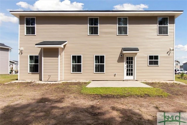 rear view of house with a patio