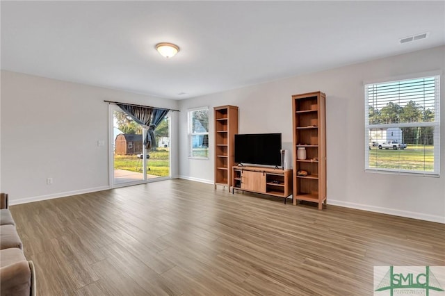 unfurnished living room with hardwood / wood-style floors