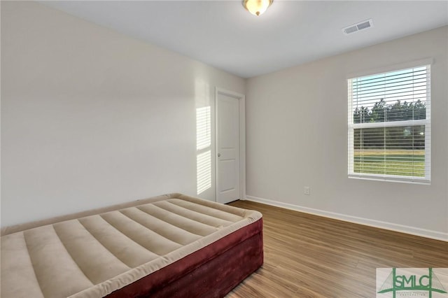 bedroom featuring hardwood / wood-style flooring