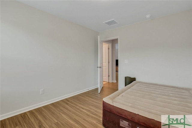 bedroom with light hardwood / wood-style flooring