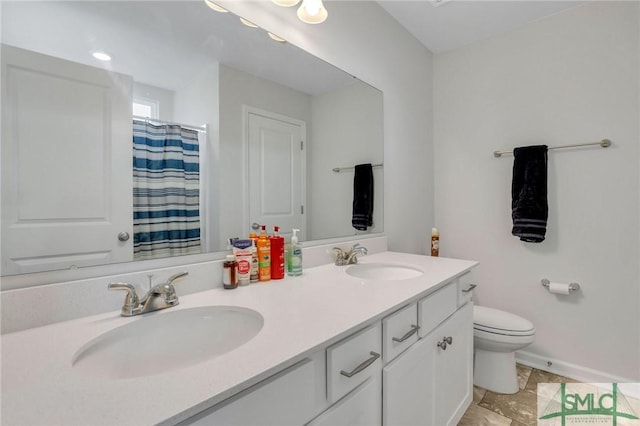 bathroom featuring vanity, a shower with curtain, and toilet