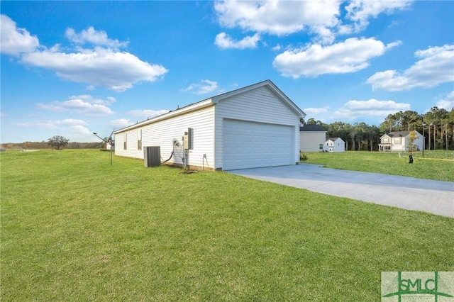 garage with cooling unit and a lawn