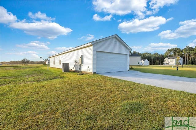 view of side of home featuring a garage, a lawn, and central air condition unit