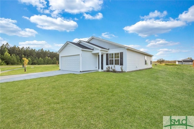 view of front of house with a garage and a front yard