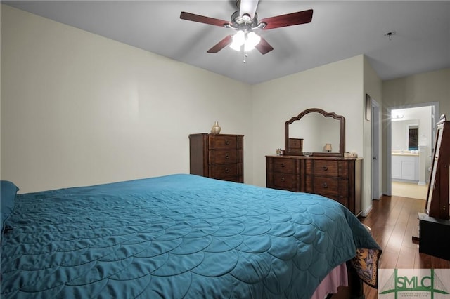 bedroom with ceiling fan, wood-type flooring, and connected bathroom