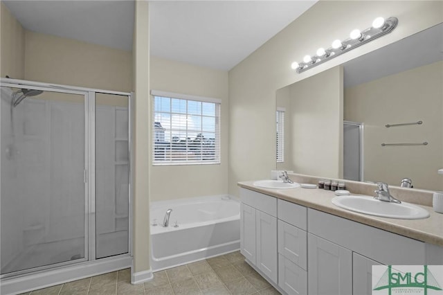 bathroom with vanity, tile patterned floors, and separate shower and tub