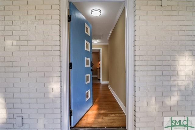 corridor featuring crown molding