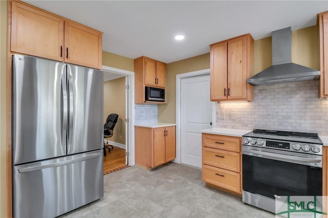 kitchen with wall chimney exhaust hood, stainless steel appliances, light brown cabinetry, and tasteful backsplash