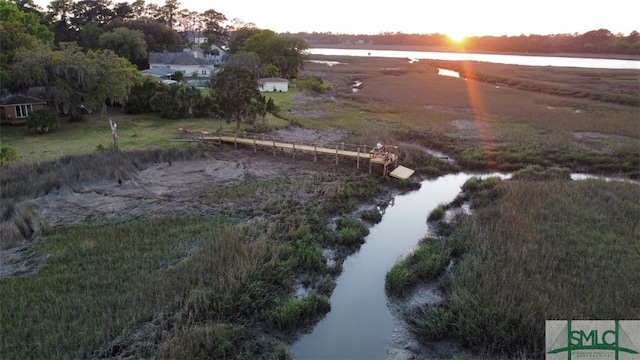 aerial view at dusk with a water view