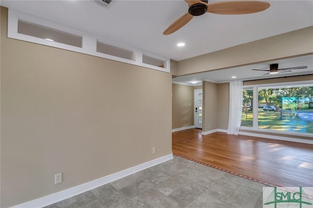 empty room with light hardwood / wood-style flooring and ceiling fan