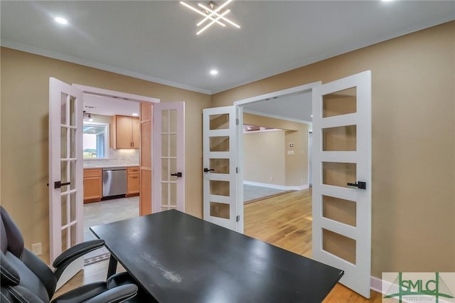 office space with crown molding, light hardwood / wood-style flooring, and french doors