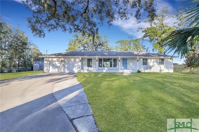 ranch-style house featuring a garage and a front yard