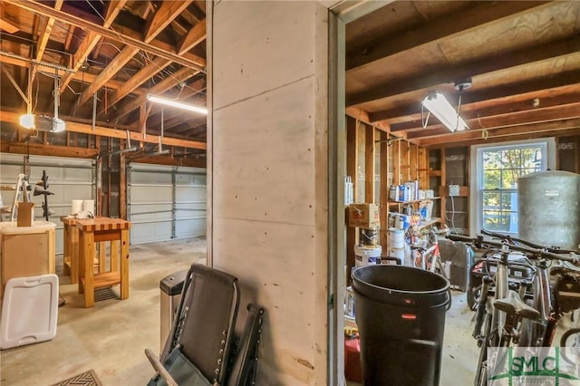 garage with a garage door opener and washer / dryer