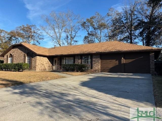 ranch-style house featuring a garage and a carport