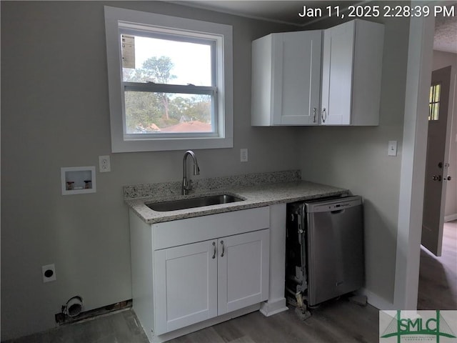 kitchen with white cabinetry, sink, light stone counters, and dishwasher