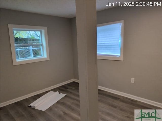 unfurnished room featuring dark hardwood / wood-style flooring