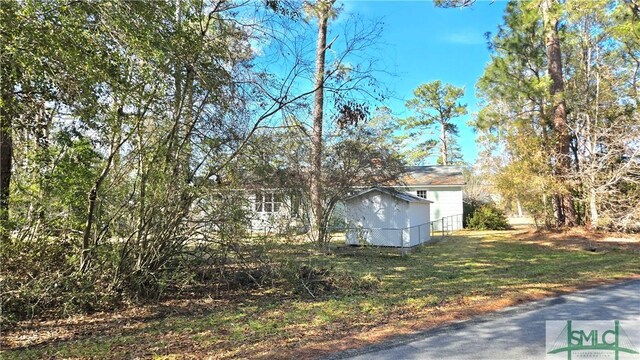 view of side of home with fence