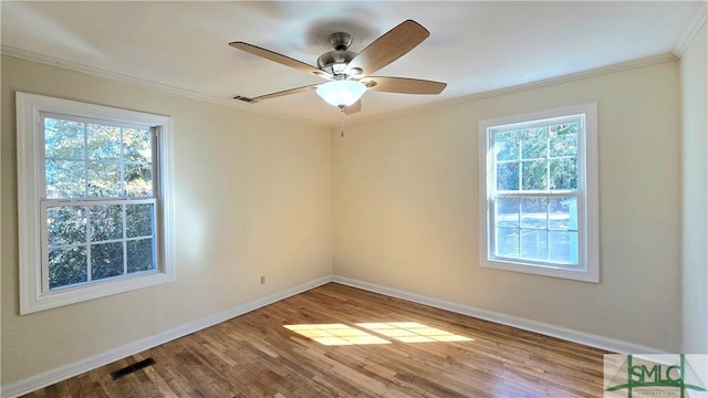 unfurnished room featuring ceiling fan, ornamental molding, a healthy amount of sunlight, and light hardwood / wood-style floors