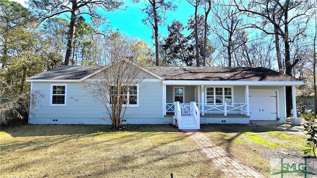 ranch-style home featuring a porch, a garage, and a front yard