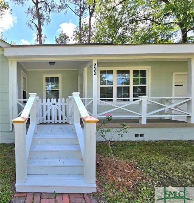 doorway to property featuring covered porch