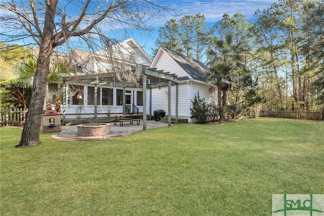 back of house with a yard, a pergola, a sunroom, and an outdoor fire pit