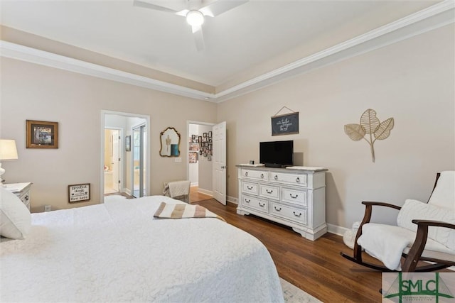 bedroom with ensuite bathroom, dark wood-type flooring, crown molding, and ceiling fan