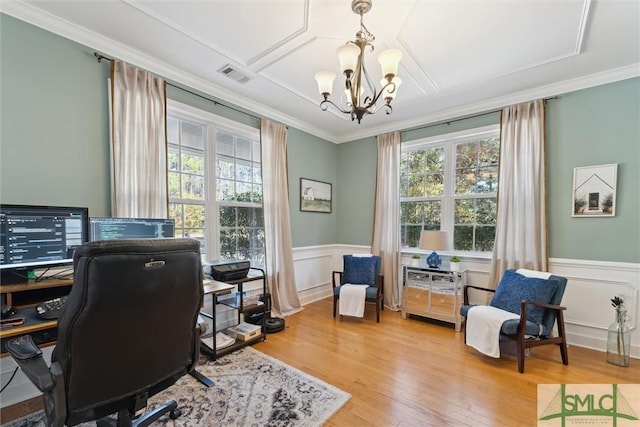 office space with an inviting chandelier, crown molding, and hardwood / wood-style flooring