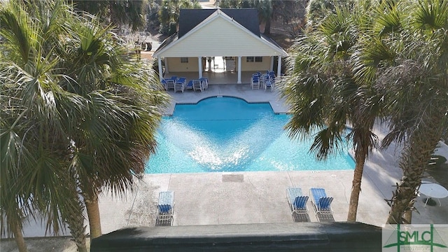 view of swimming pool with a patio area