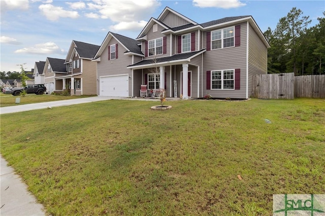 view of front of home with a garage and a front yard