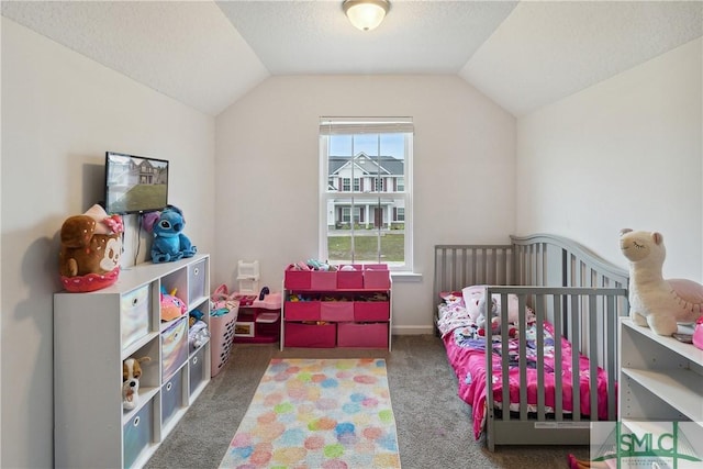 carpeted bedroom with lofted ceiling and a textured ceiling