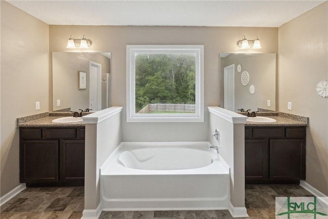 bathroom with vanity and a bathtub