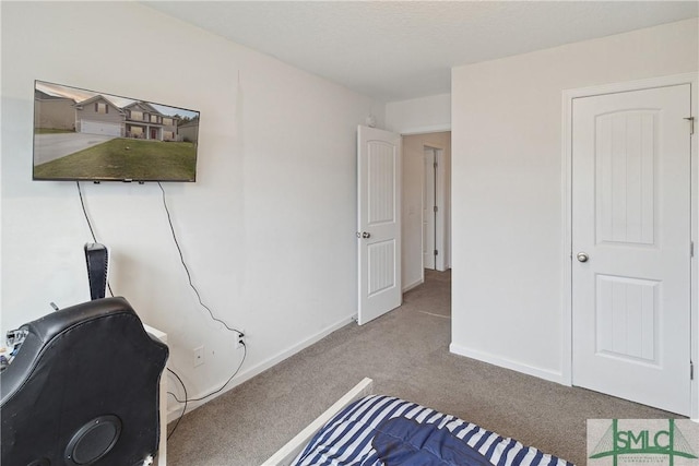 bedroom featuring light carpet