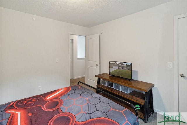 interior space with carpet flooring and a textured ceiling