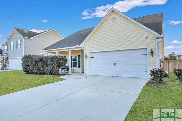 view of front facade with a garage and a front yard