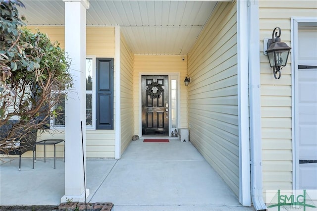 view of exterior entry featuring a garage