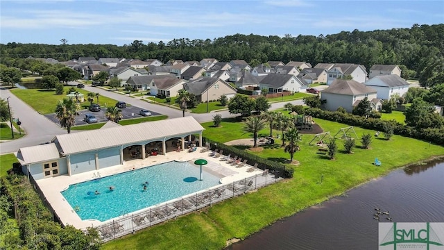 aerial view featuring a residential view and a water view