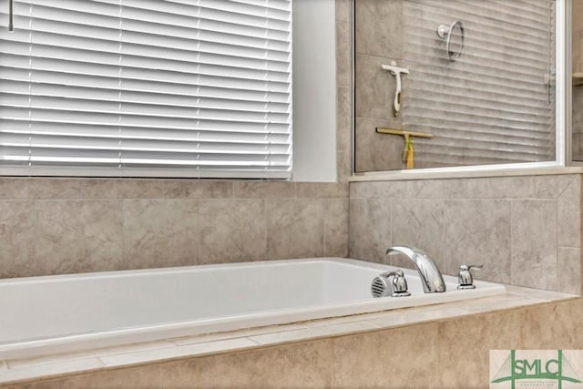 bathroom featuring a relaxing tiled tub