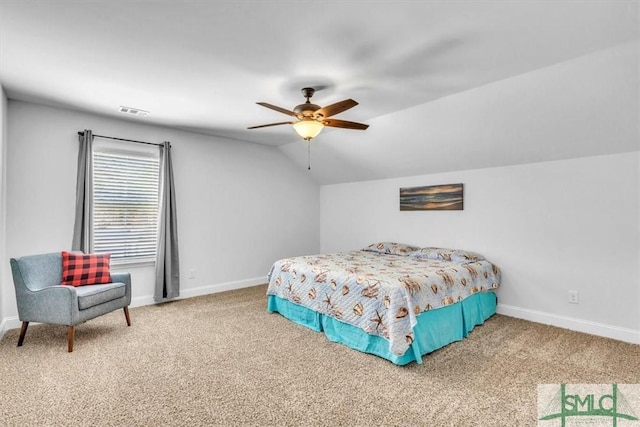 carpeted bedroom featuring ceiling fan and vaulted ceiling