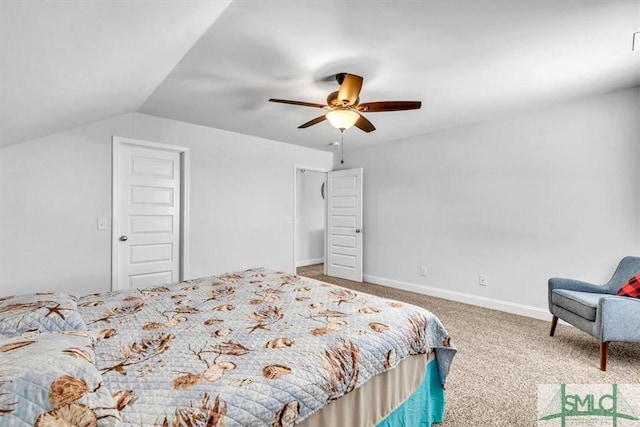 carpeted bedroom with ceiling fan and vaulted ceiling