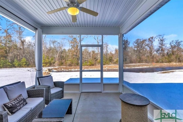 sunroom / solarium with ceiling fan and a wealth of natural light