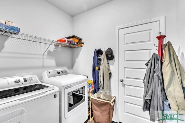 washroom featuring washer and clothes dryer