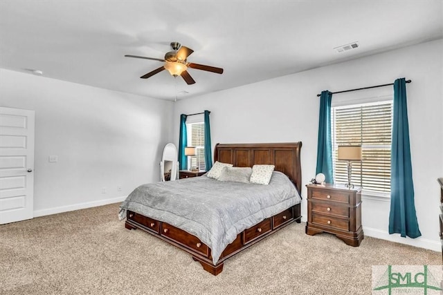 bedroom featuring light carpet and ceiling fan