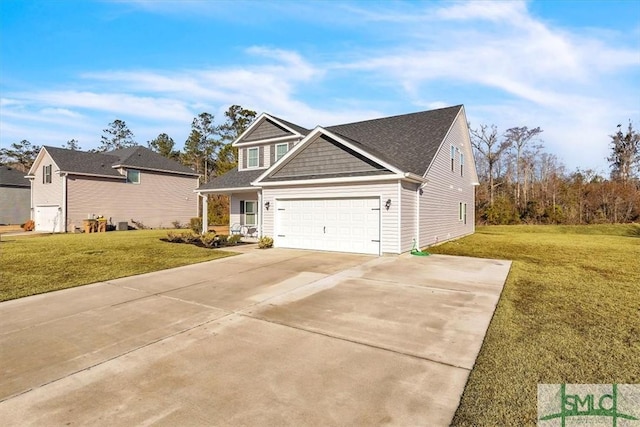 view of front of house featuring a garage, a front lawn, and covered porch