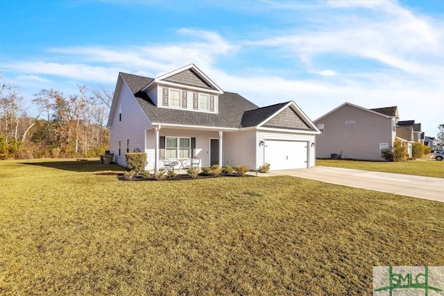 view of front of property with a garage and a front lawn