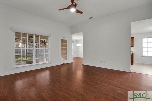 unfurnished living room featuring ceiling fan, ornamental molding, and dark hardwood / wood-style flooring