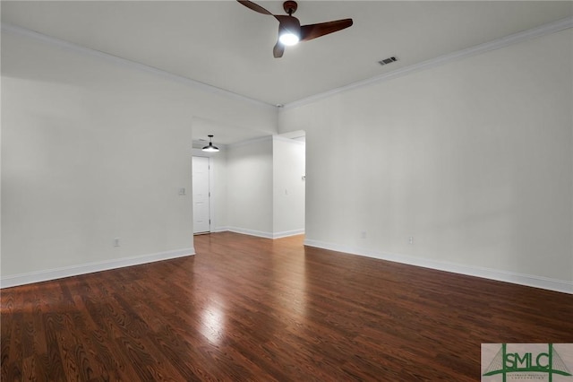 empty room featuring ornamental molding, dark hardwood / wood-style floors, and ceiling fan