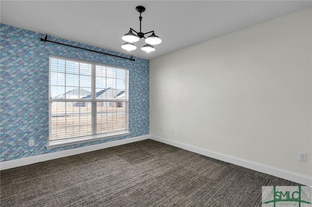 unfurnished dining area featuring a notable chandelier and dark carpet