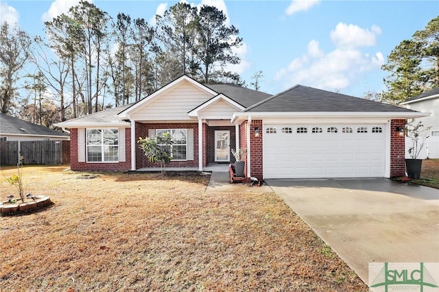 ranch-style house featuring a garage and a front yard