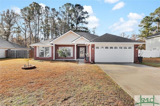 ranch-style home featuring a garage and a front yard